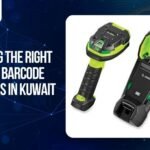 Industrial Zebra barcode scanner and charging cradle for business operations in Kuwait. The graphic highlights the transition from 1D to 2D and RFID scanning technologies for improved data accuracy and workflow efficiency.