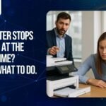 An office team in Kuwait looking frustrated around a malfunctioning office printer, representing business downtime. Featuring the Al-Zahabi logo and a call to action: "The printer stops working at the wrong time? Here is what to do."