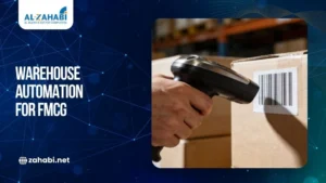 Handheld barcode scanner scanning a barcode label on a cardboard box, illustrating warehouse automation solutions for the FMCG industry through automated inventory tracking.